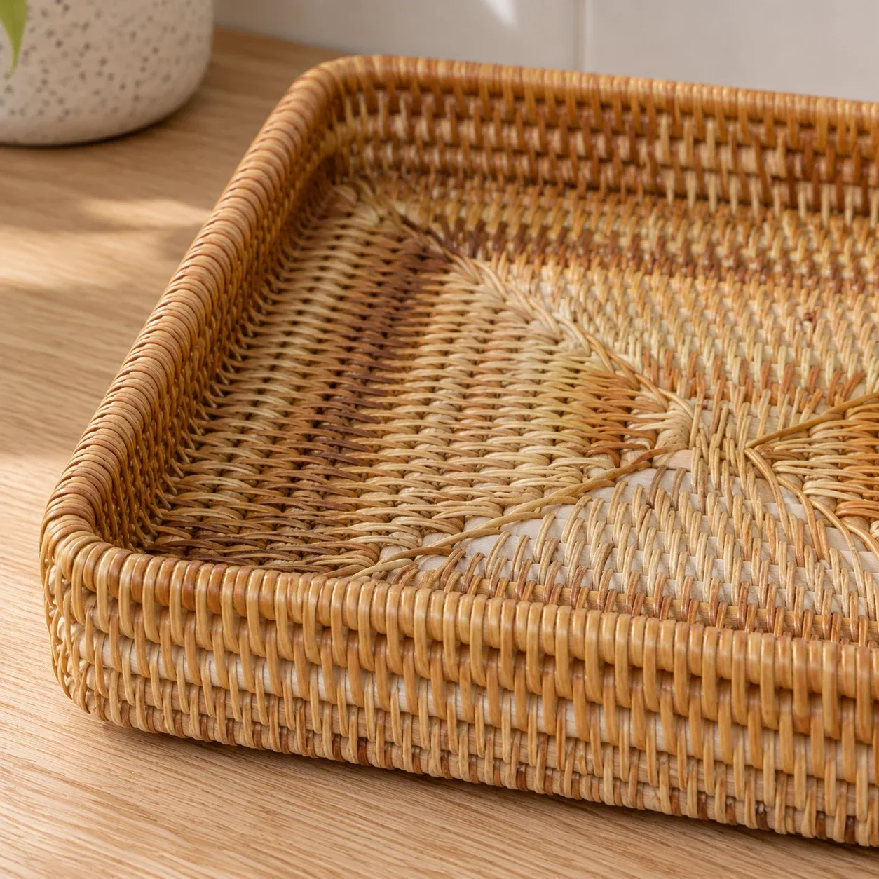Close view of wrapped rattan corner rim and woven base